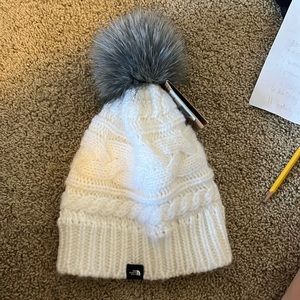 New white north face winter hat. Never worn.